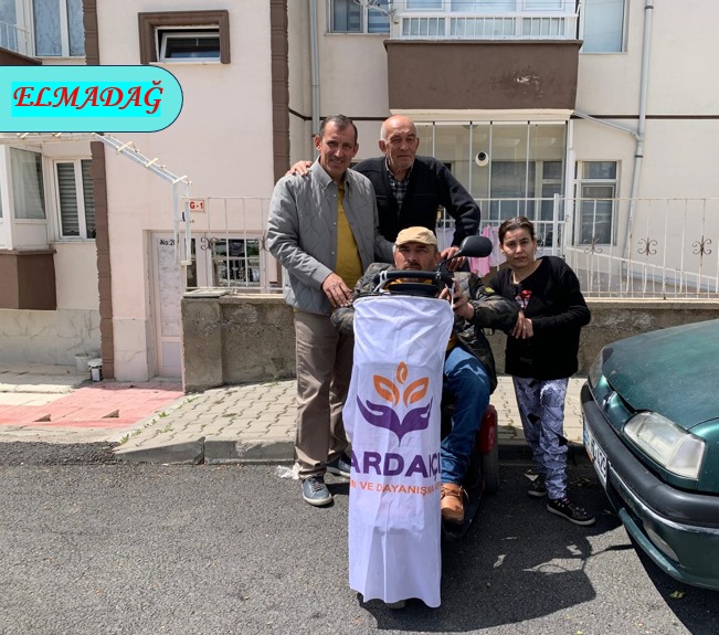 Photos from powered wheelchair distribution events.