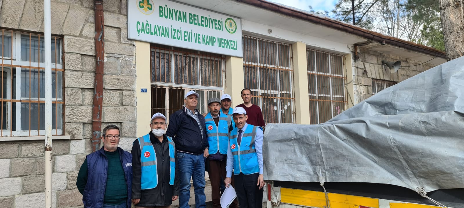 Photos from powered wheelchair distribution events.