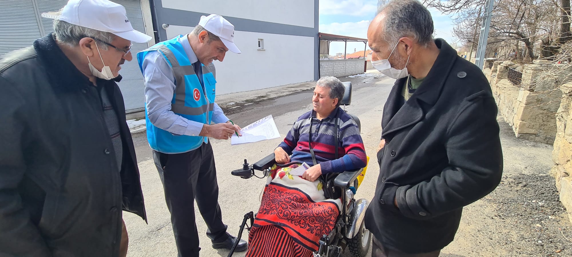 Photos from powered wheelchair distribution events.