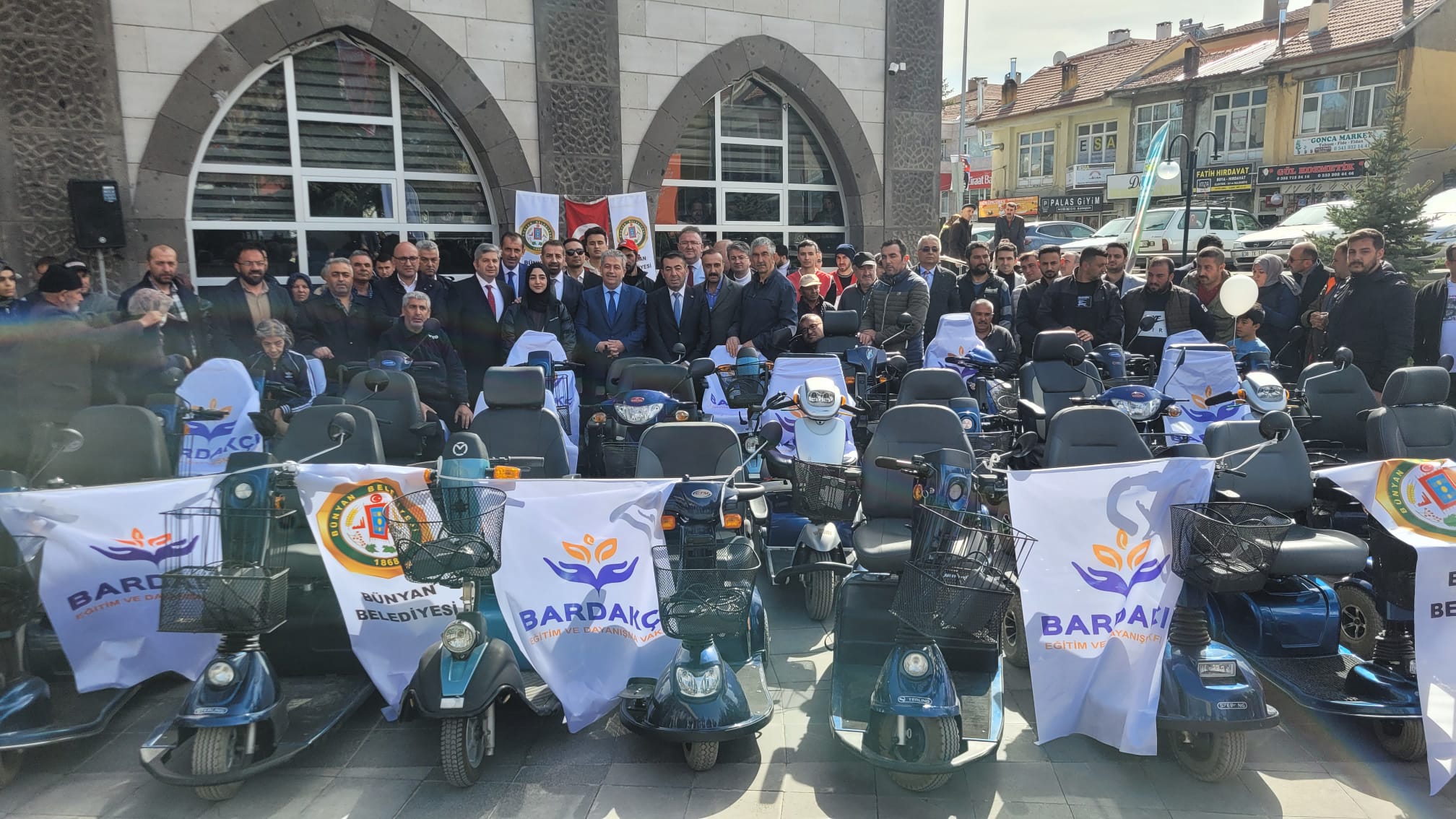 Photos from powered wheelchair distribution events.
